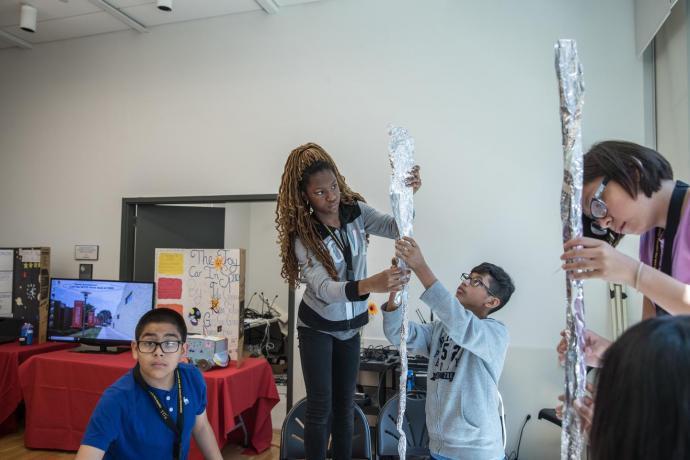 The day's hands-on activity had campers constructing "space elevators" out of aluminum foil. 