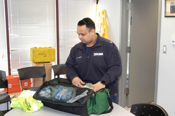 As part of his student EMT duties, Dhwanil Kadakia checked the EMT supplies bag.