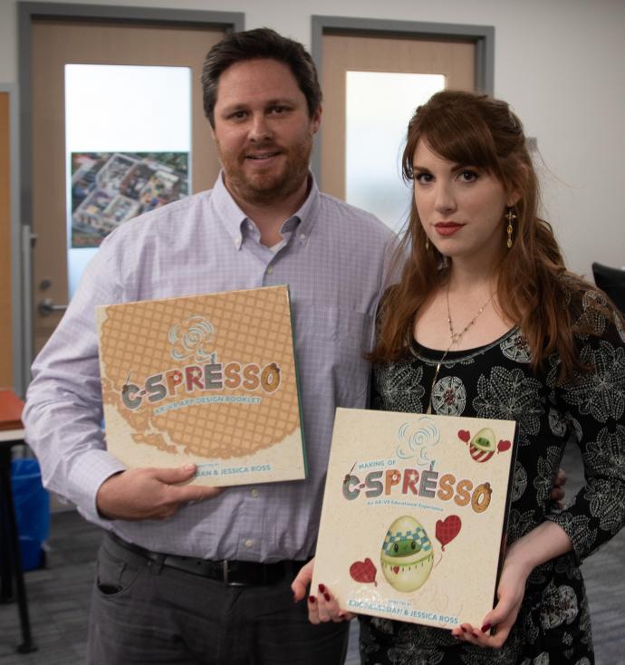 Nersesian and design professor Jessica Ross show their book for an augmented reality project