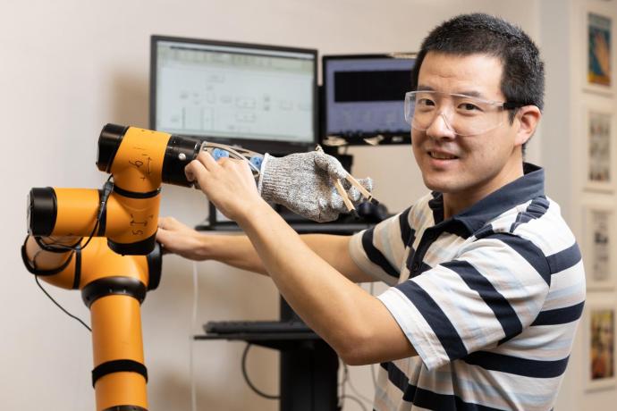 Associate Professor Cong Wang taught a robotic hand to use chopsticks