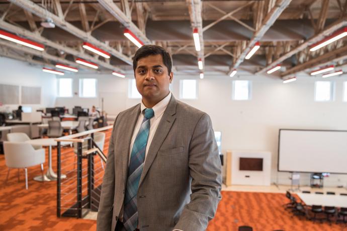 Balavignesh Thirumalainambi poses in the Agile Strategy Lab inside of Central King Building