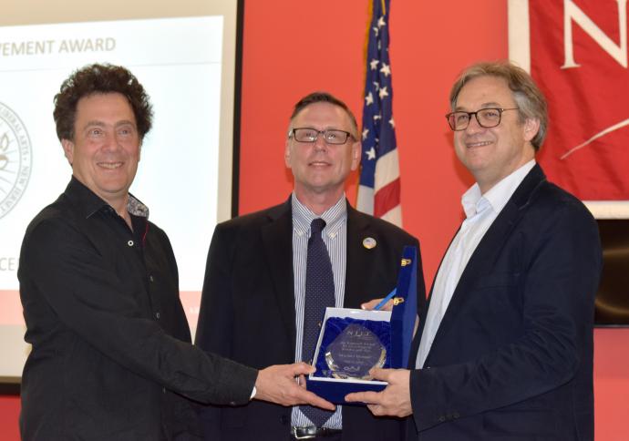 David Rothenberg, distinguished professor of humanities (left) and Dr. Kevin Belfield present Benson with the Kappraff Award for Excellence in Science and Arts.