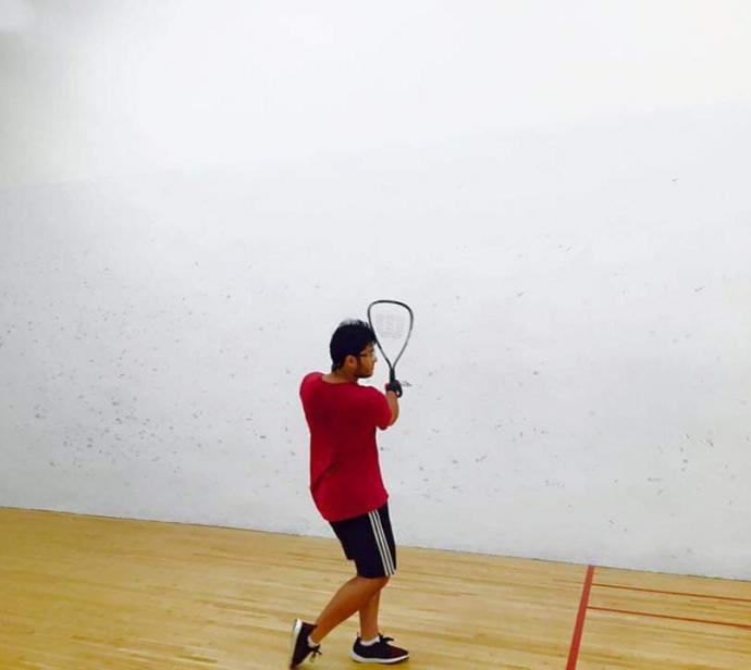 Khode hits the racquetball court.