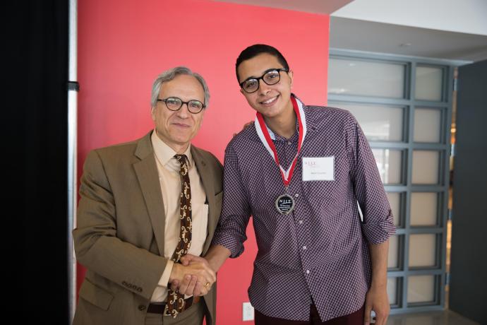 NJIT Provost and Senior Executive Vice President Fadi P. Deek awards Elzomor for his work at the 2018 Dana Knox Student Research Showcase.