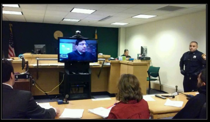 Judge Mohammed appearing remotely by Skype in his courtroom.