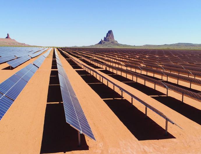 Automated solar panel arrays convert sunlight to electricity at the Kayenta Solar Project facility in Kayenta, Arizona. 