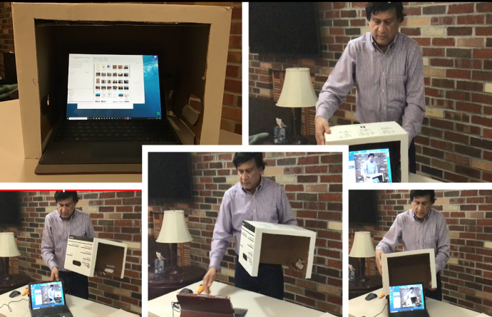 Judge Mohammed's DIY privacy guard for virtual court proceedings, fashioned from a moving box.