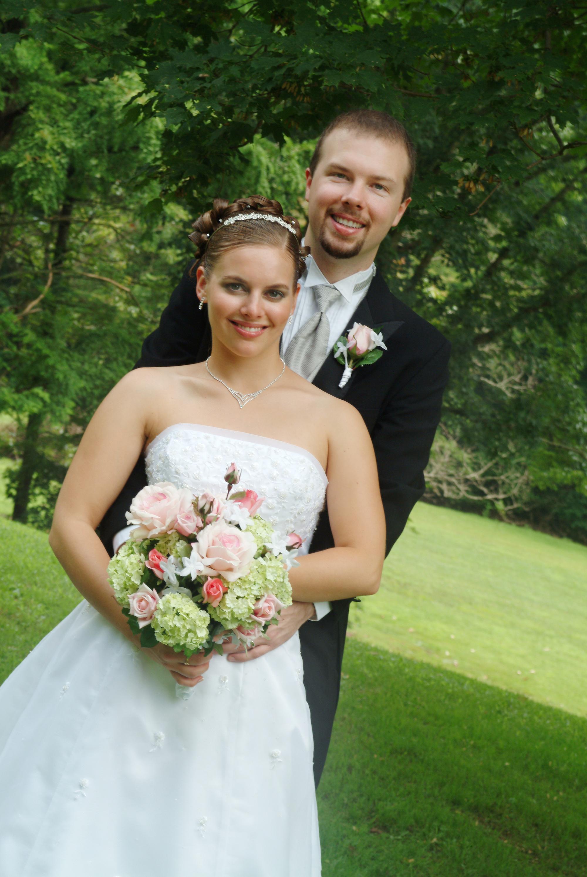 Karisa and Tom Schreck at their wedding (top) and with their family (below)