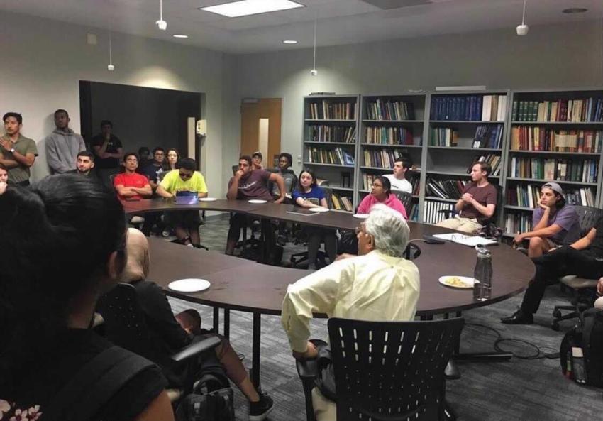 Jay Meegoda leads the student engineers in discussion about the Ecuador water project. 