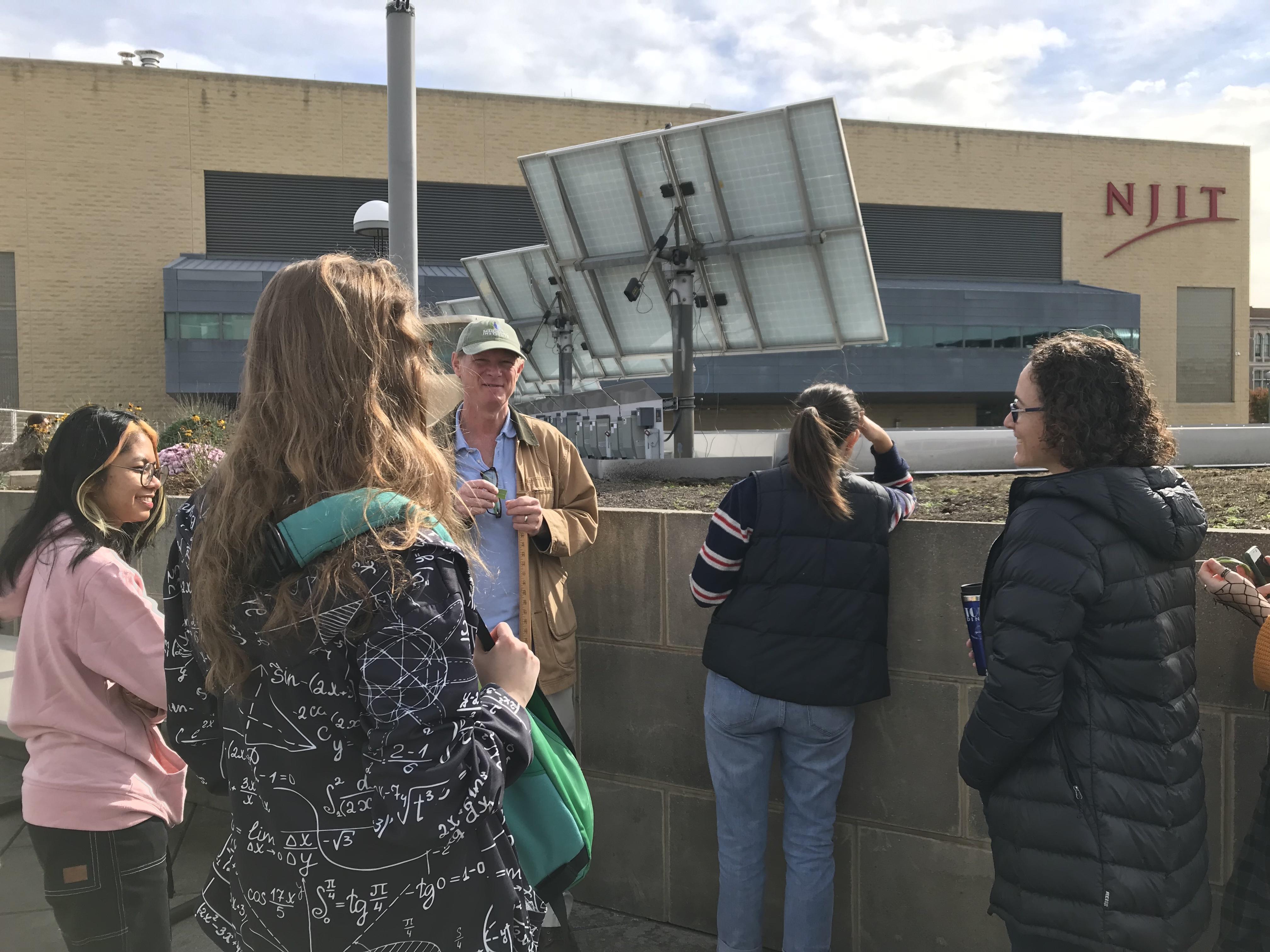 Members of NJIT’s Urban Ecology Lab (UEL) monitor the progress of the Newark Rooftop Therapy Garden.