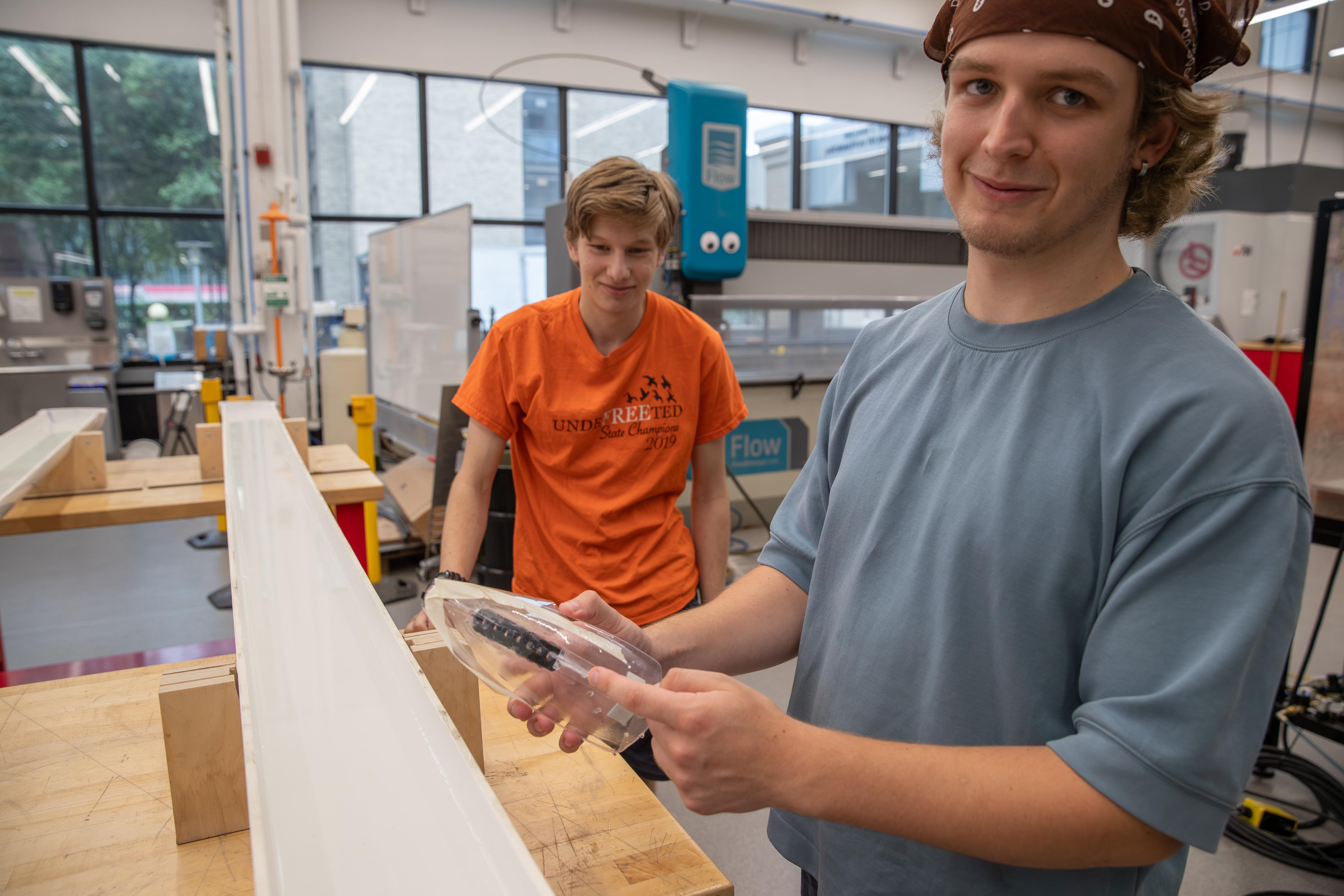 Rutka and Steinberg show the unique design of their team's boat.
