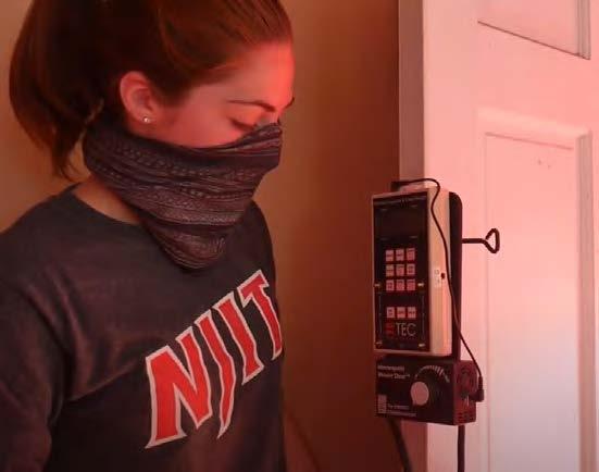 Gasbarro setting up the blower door test equipment. 