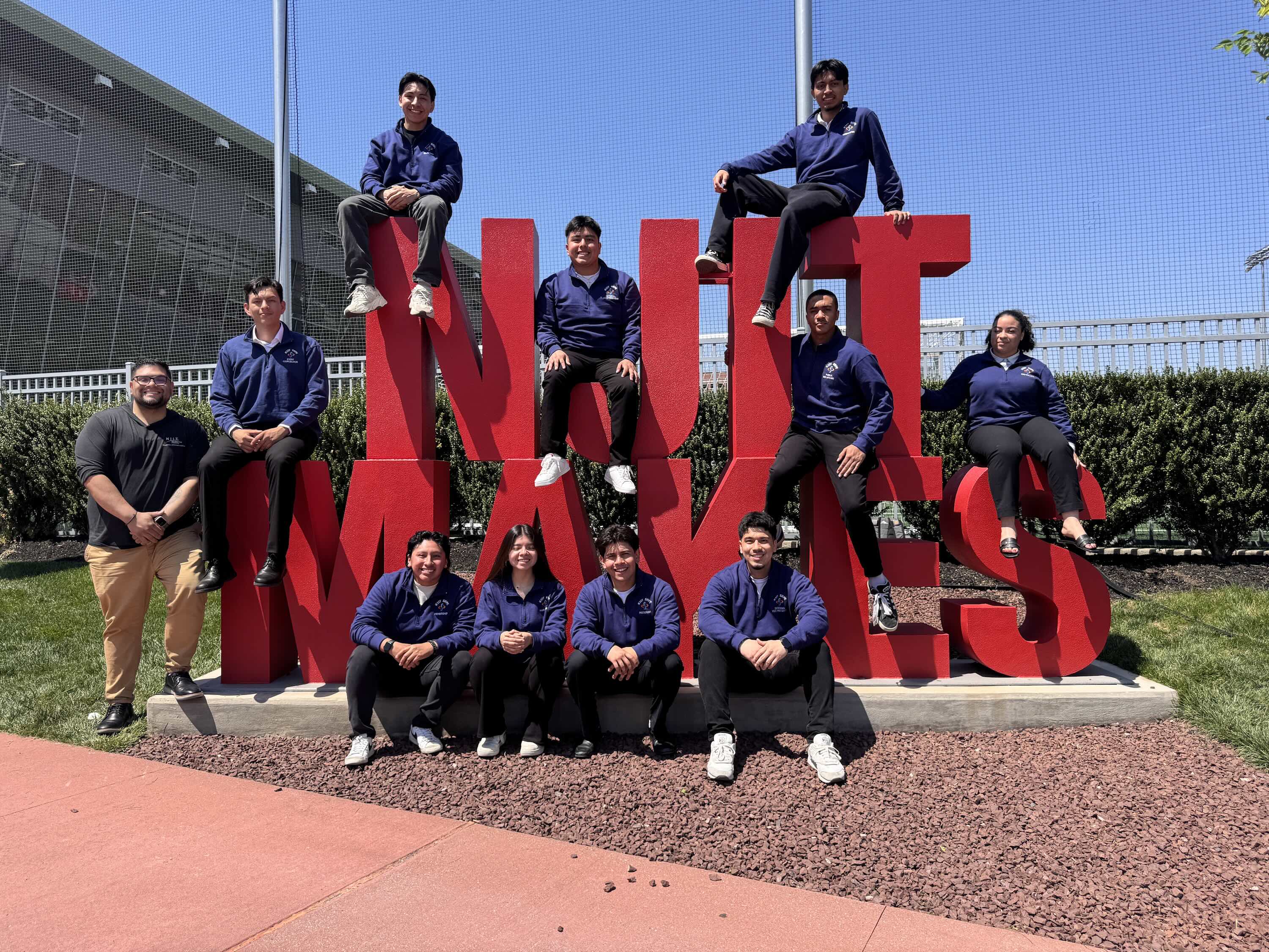 Students with NJIT Makes sign