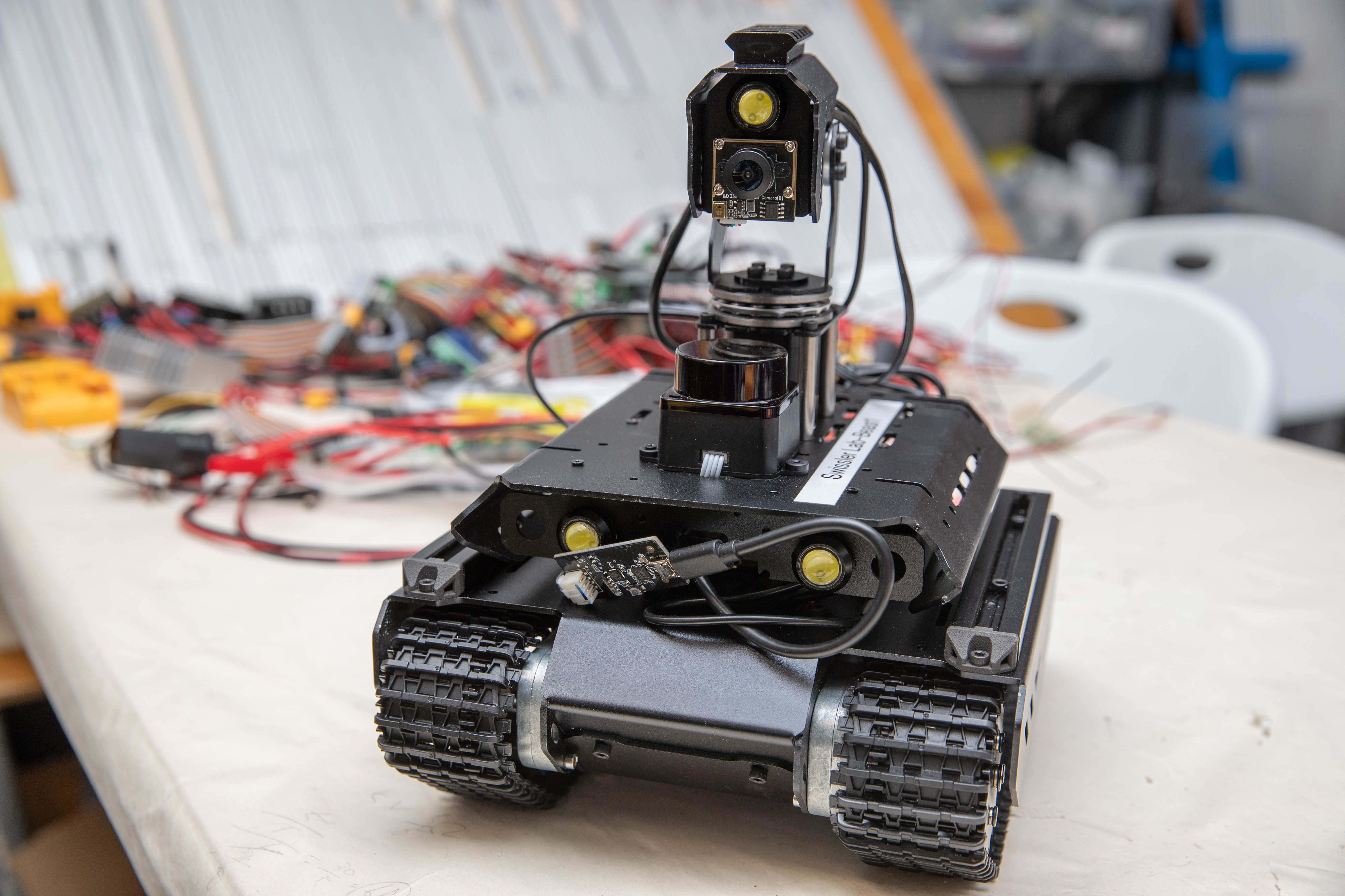 Built at Swissler Innovative Robotics Lab, robots resembling miniature Mars rovers inspired Mejia's proposal for one class of autonomous swarm robots capable of working on the moon.