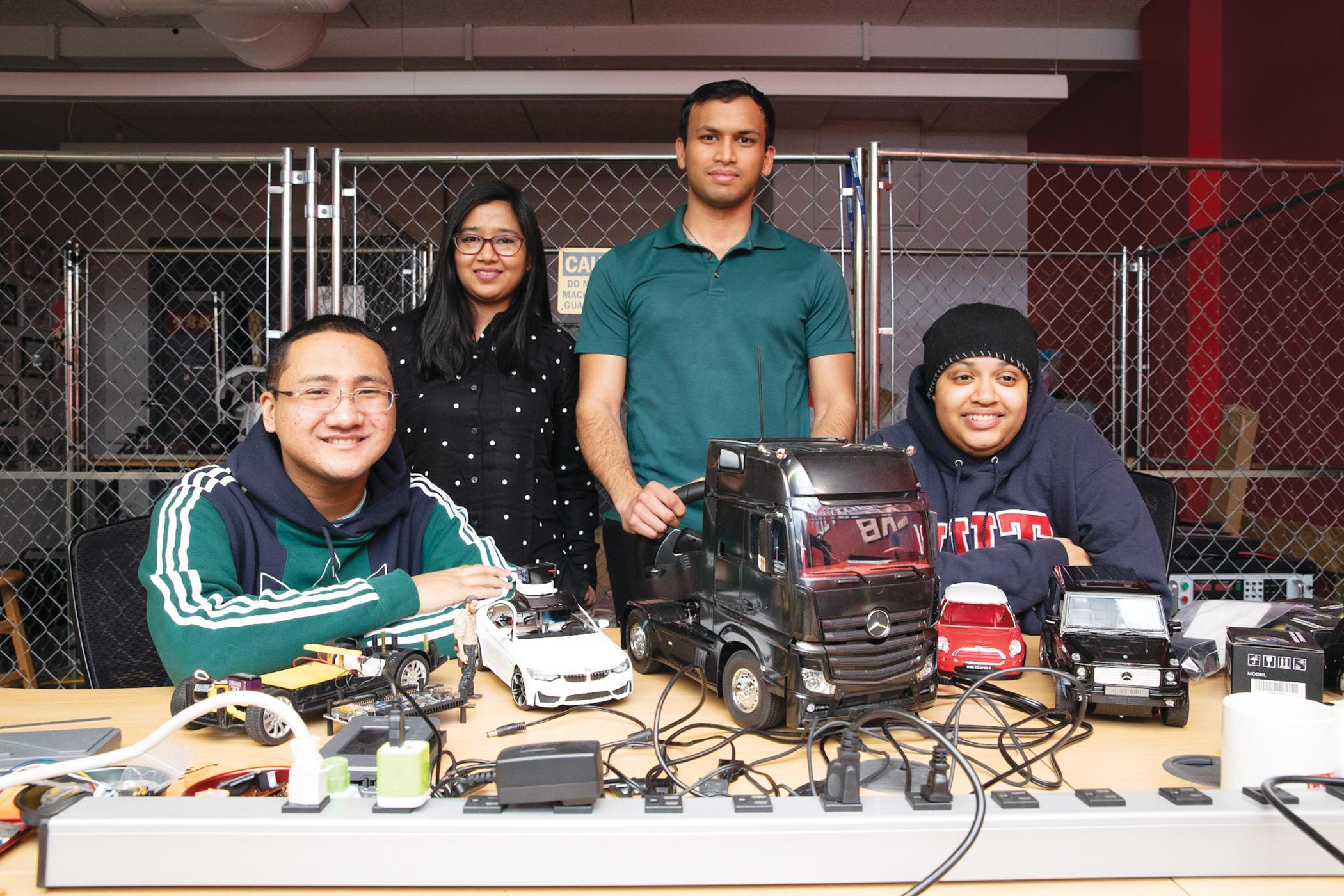 (From left to right), Carlos Maranon, Zarin Rahman, Nishaant Goswamy and Alexis Brice developed automotive systems for a fleet of toy vehicles.