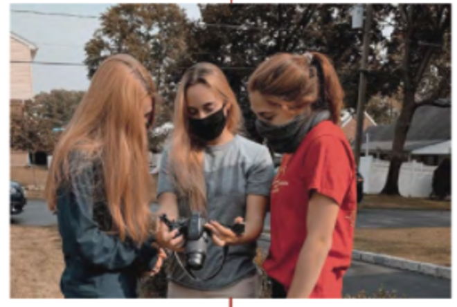 Student team Nicole Kistner, Kaitlyn McKenna and Marissa Gasbarro looking at IR images of a Re-Side right house. 