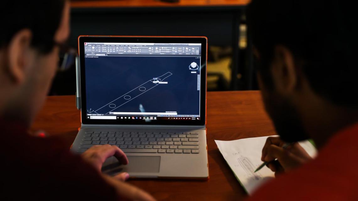 Students participating in the Honors Summer Research Institute produce a 3D CAD model.