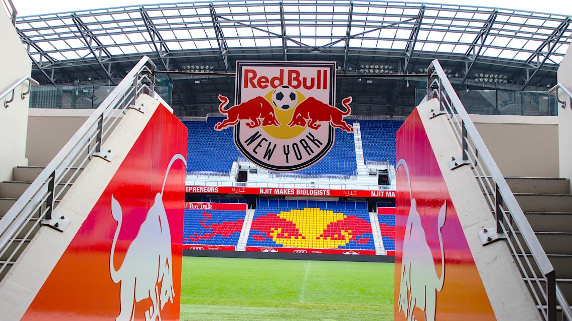 Red Bull Arena Entrance with "NJIT Makes Biologists" on the Ribbon LED Screen in Background