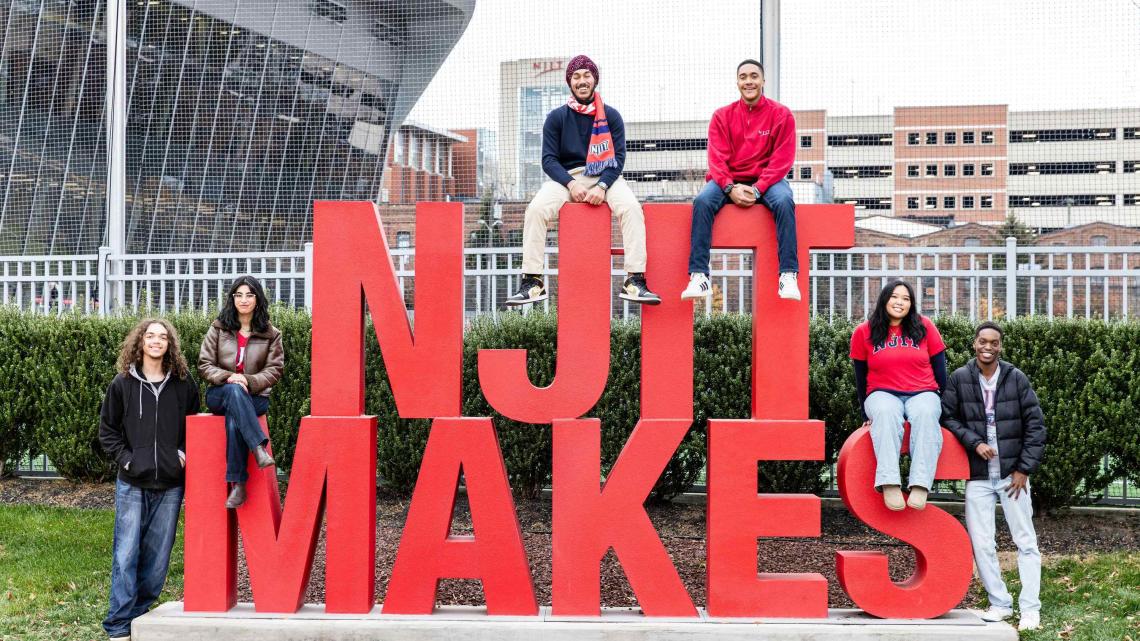 Students with NJIT Makes sign