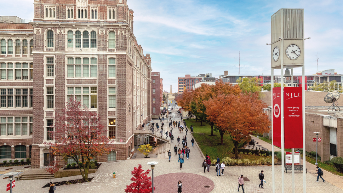 NJIT campus featuring trees changing color in fall, NJIT clocktower and Central King Building