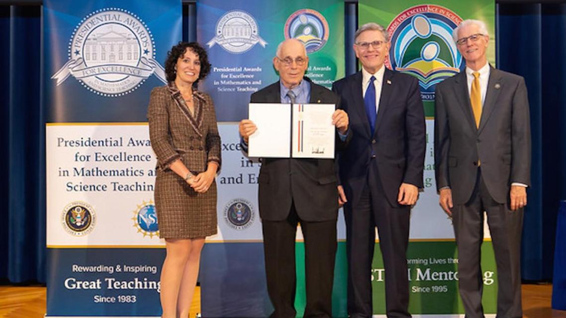 Howard Kimmel, NJIT professor emeritus, accepts his PAESMEM award.