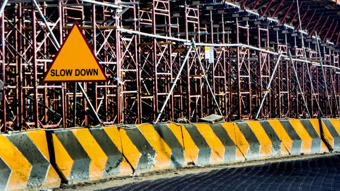 Construction site with a "slow down" sign