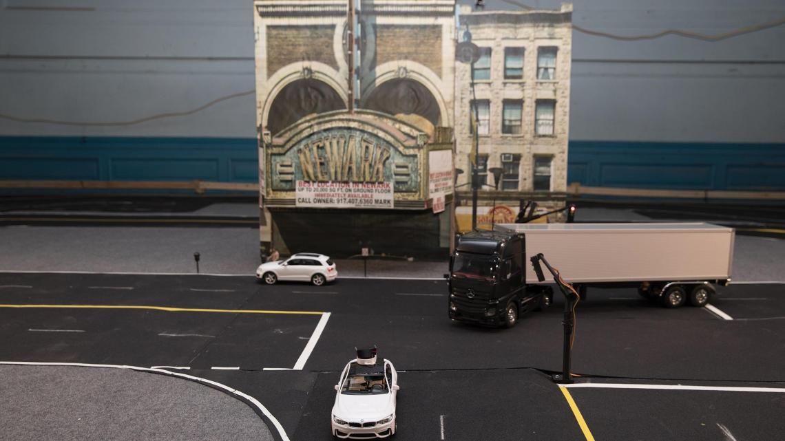 Students in Cong Wang’s Control Automation Robotics Lab are developing cars, guided by remote drivers at gaming-style steering wheel and pedal control stations, that will be deployed on the streets of a miniaturized Newark, N.J.