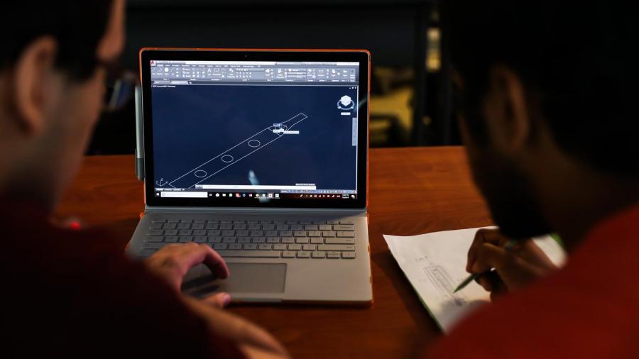 Students participating in the Honors Summer Research Institute produce a 3D CAD model.