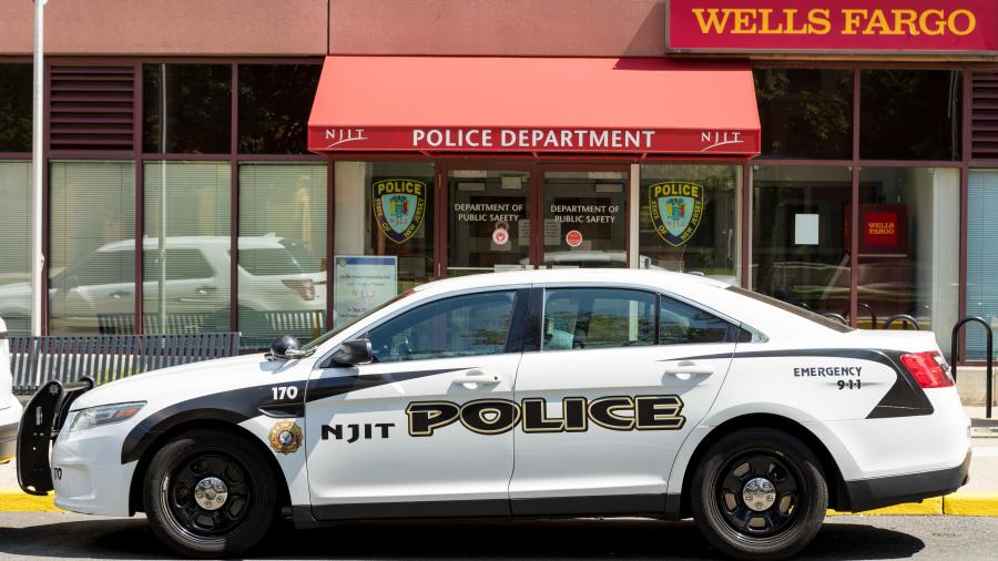 An NJIT Police car parked in front of the NJIT Police Department.