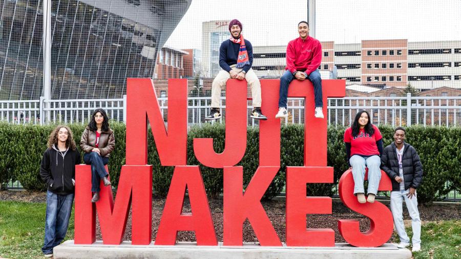 Students with NJIT Makes sign