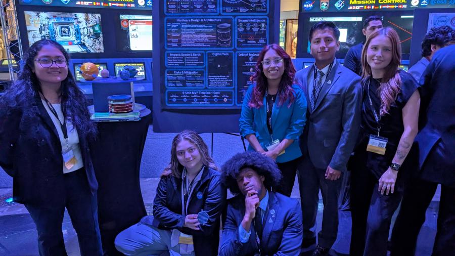 Undergrads Andrea Yanez Soto, Natalie Kiwanian, KesUranNu Baylor, Tatiana Mejia, Kevin Gutama and Jennifer Salto (from left) with their project display during the NASA ORBIT Challenge in Houston.