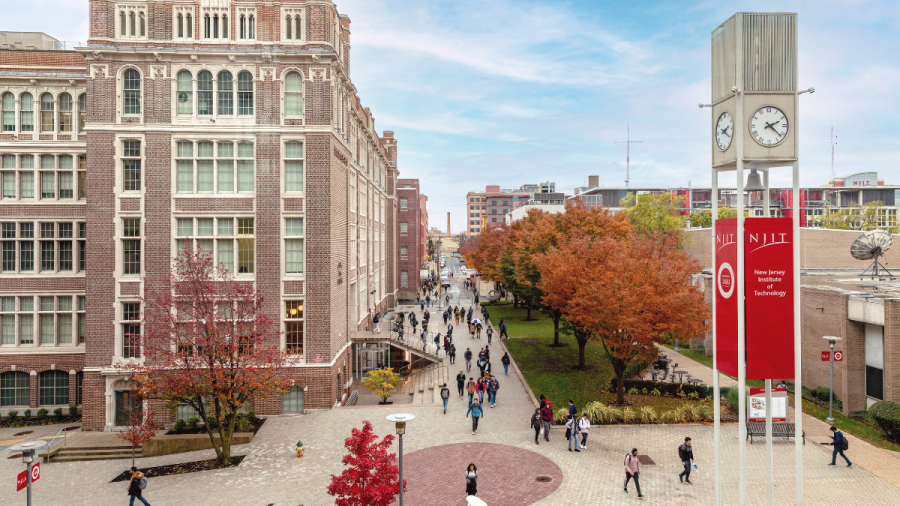 NJIT campus featuring trees changing color in fall, NJIT clocktower and Central King Building