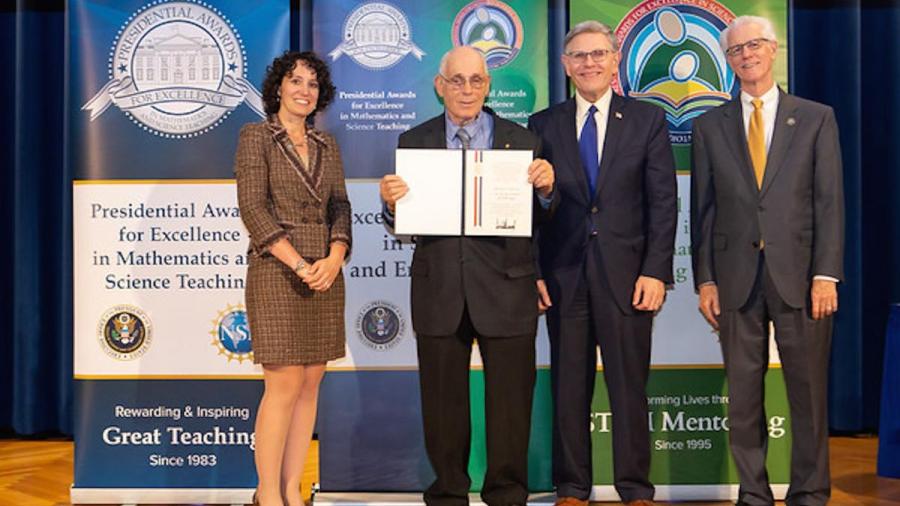Howard Kimmel, NJIT professor emeritus, accepts his PAESMEM award.