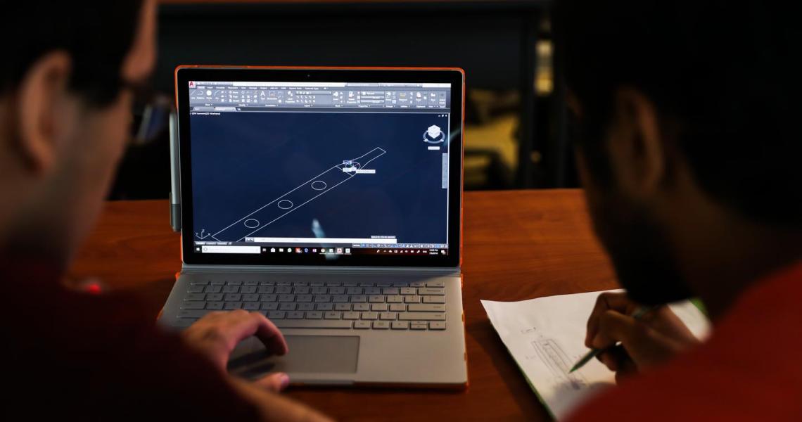 Students participating in the Honors Summer Research Institute produce a 3D CAD model.