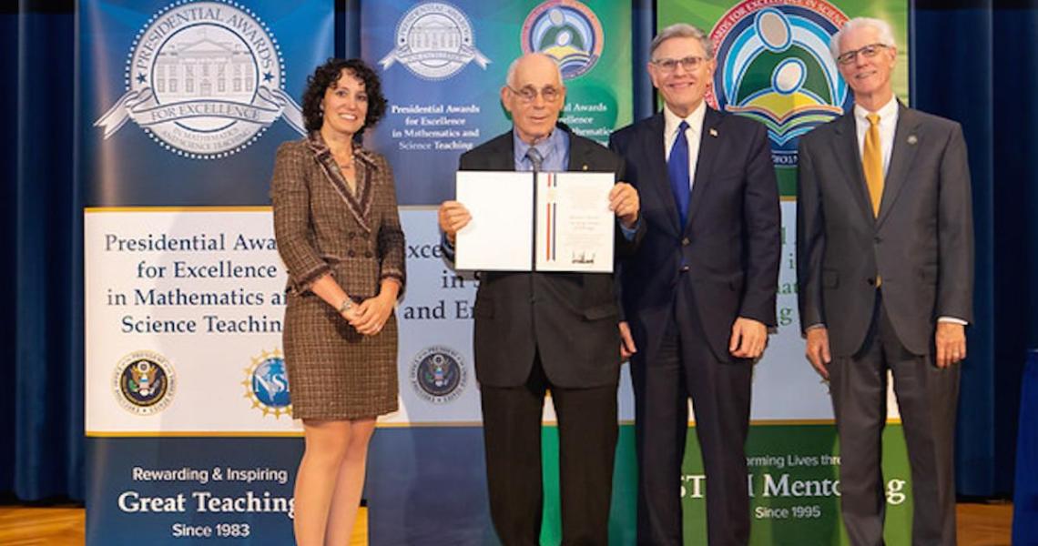 Howard Kimmel, NJIT professor emeritus, accepts his PAESMEM award.