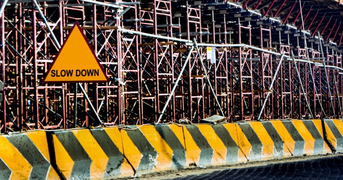 Construction site with a "slow down" sign