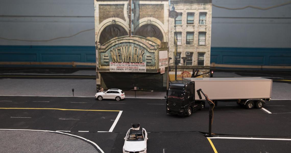 Students in Cong Wang’s Control Automation Robotics Lab are developing cars, guided by remote drivers at gaming-style steering wheel and pedal control stations, that will be deployed on the streets of a miniaturized Newark, N.J.