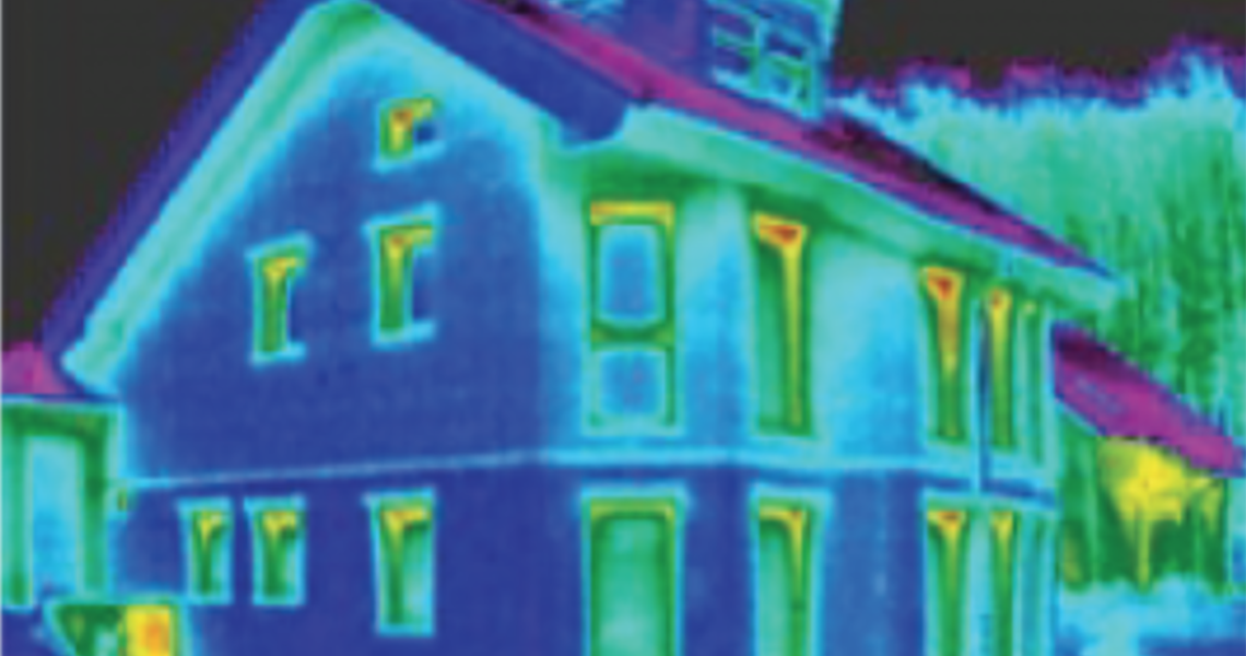 Infrared (IR) image of well insulated house showing minor leakage of heat near the tops of windows. 