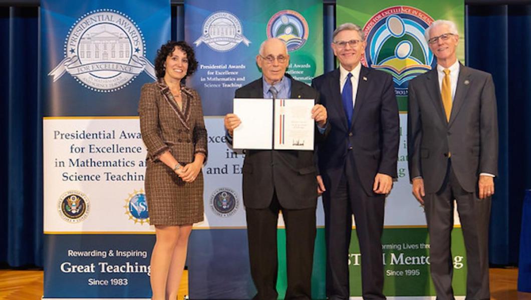 Howard Kimmel, NJIT professor emeritus, accepts his PAESMEM award.