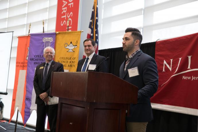 Stephen Najemian (at podium) thanked CDS for naming Prudential Most Engaged Partner, as Martin Tuchman School of Management Dean Reggie Caudill (far left) and Steven B. Saperstein ’84, a member of NJIT’s Board of Overseers and a Prudential COO, looked on.