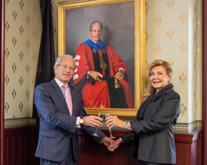 Drs. Joel and Diane Bloom celebrate the portrait unveiling.