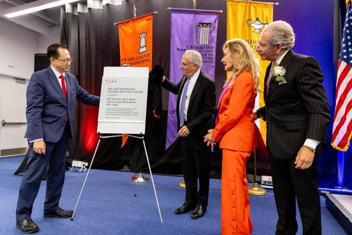 NJIT President Teik Lim and Board of Trustees Chair Robert Cohen unveil a plaque in dedication to Diane and Joel Bloom.