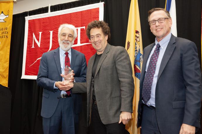 Agnello (left) presented with the Jay Kappraff Award for Excellence in Science and Arts by professor David Rothenberg and Dean Kevin Belfield.