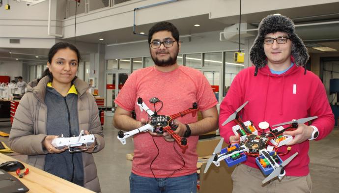 Shruti Kulkarni, Dip Panchal and Piotr Rzymski prepare for the May 1 student drone competition in NJIT’s Makerspace.