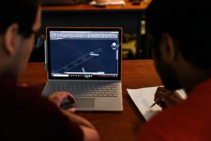 Students participating in the Honors Summer Research Institute produce a 3D CAD model.