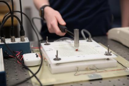 Student conducting modal testing on campus during summer 2018.