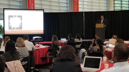Forensic science professor, David Fisher, addresses the crowd at Pre-College's STEM Forum.