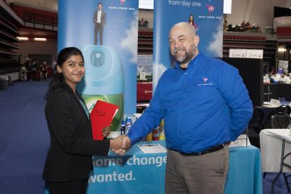 Student Eshita Shah meets with a recruiter at the Spring 2018 Career Fair.