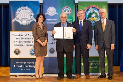 Howard Kimmel, NJIT professor emeritus, accepts his PAESMEM award.