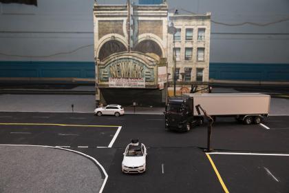 Students in Cong Wang’s Control Automation Robotics Lab are developing cars, guided by remote drivers at gaming-style steering wheel and pedal control stations, that will be deployed on the streets of a miniaturized Newark, N.J.